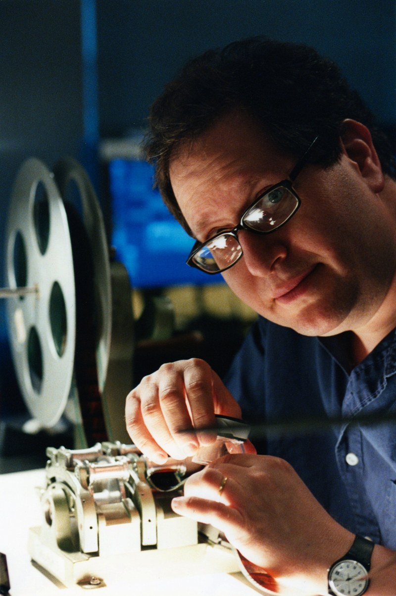 Gordon Grinberg at a film editing bench
